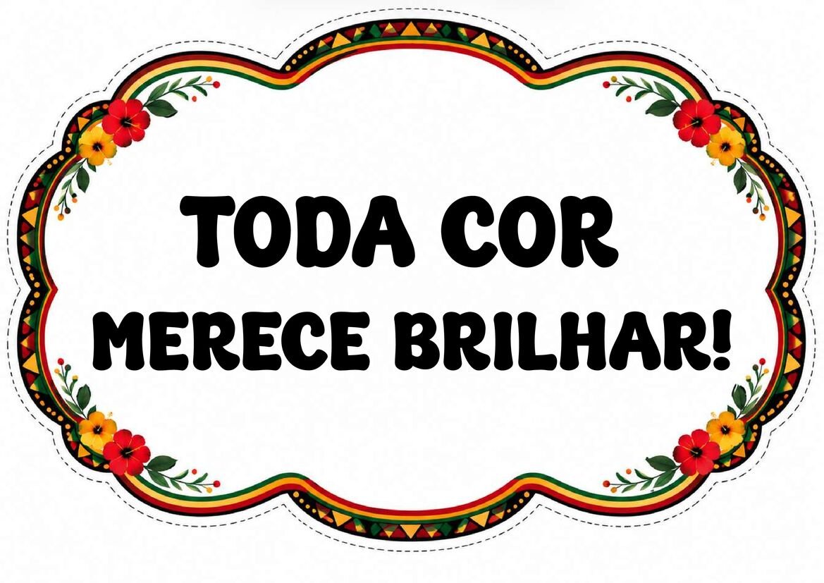Plaquinha com a frase “Toda cor merece brilhar!”, letras pretas e moldura floral colorida em fundo branco.